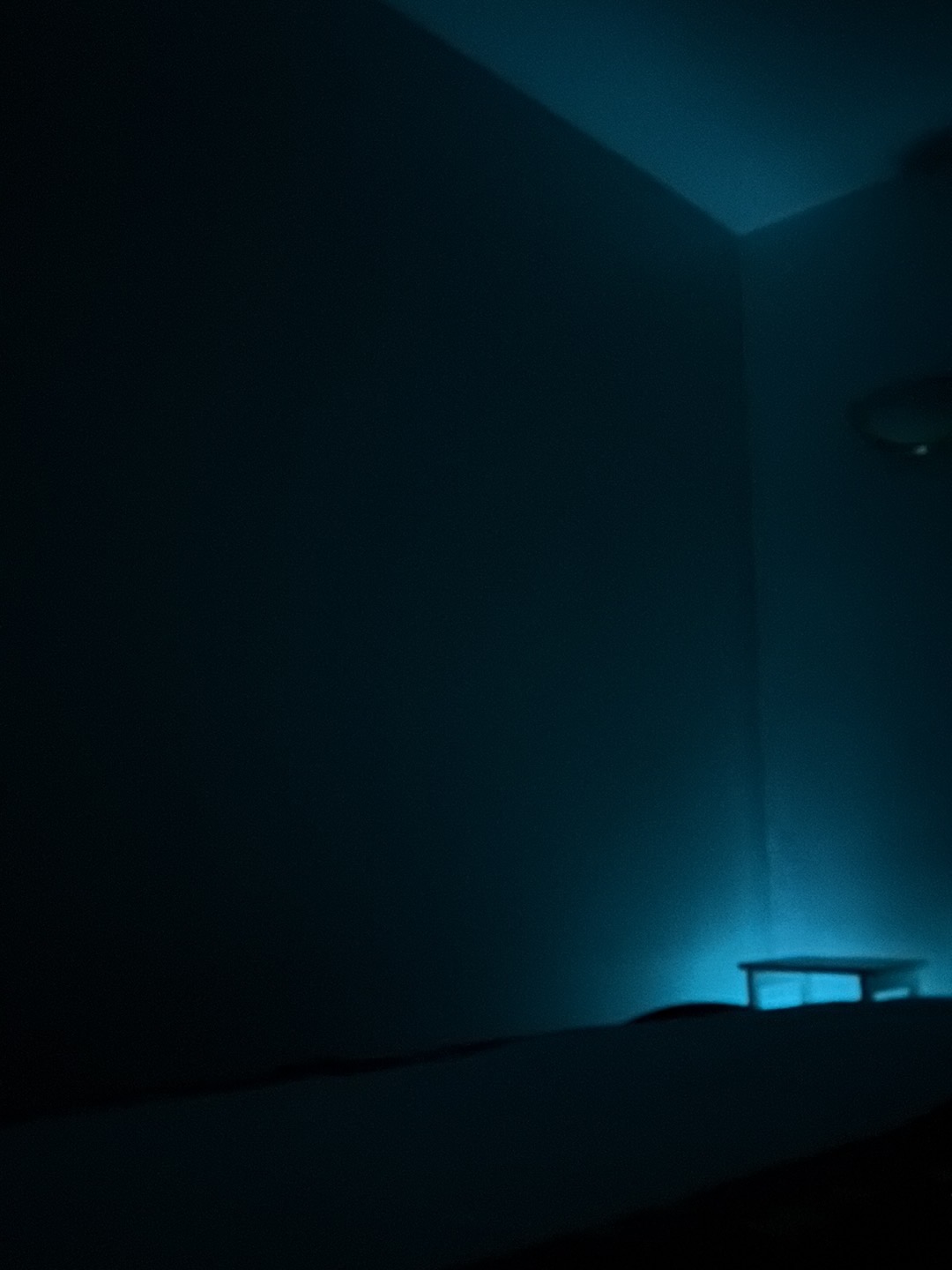 Relaxing massage room with blue ambient lighting